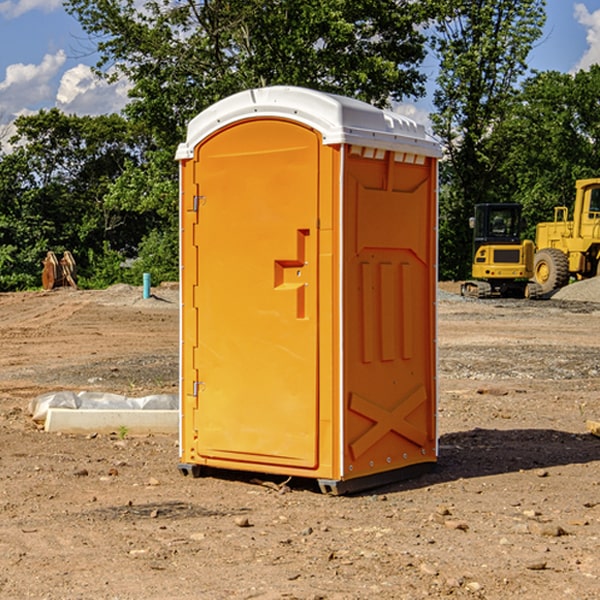 what is the cost difference between standard and deluxe portable toilet rentals in Binford